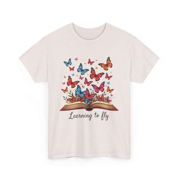 Learning to Fly: Artistic Book Illustration with Vibrant Butterflies and Creative Elegance Unisex Heavy Cotton Tee